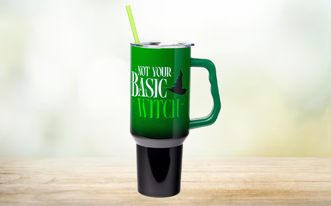 Silver Buffalo 40 Ounce Wicked Stainless Steel Tumbler with Handle and Straw on a Table Silver Buffalo 40 Ounce Wicked Stainless Steel Tumbler with Handle and Straw on a Table