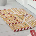 St Nicholas Square Gingerbread House Coir Doormat in front of the Door