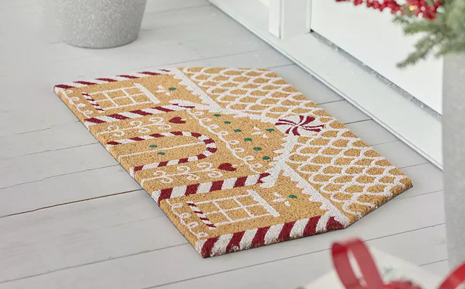 St Nicholas Square Gingerbread House Coir Doormat in front of the Door