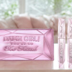 Too Faced Damn Girl Mascara Duo with Bag on a Table