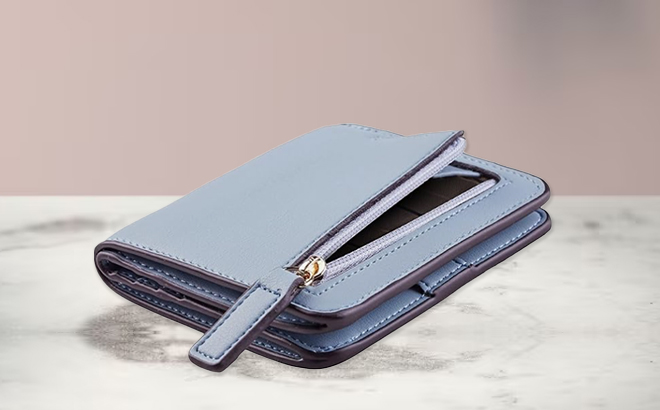 Toughergun Small Wallet with ID Window on a Marble Tabletop Toughergun Small Wallet with ID Window on a Marble Tabletop