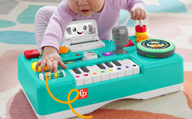 A Baby Playing with Fisher Price Laugh and Learn Mix Learn DJ Table A Baby Playing with Fisher Price Laugh and Learn Mix Learn DJ Table