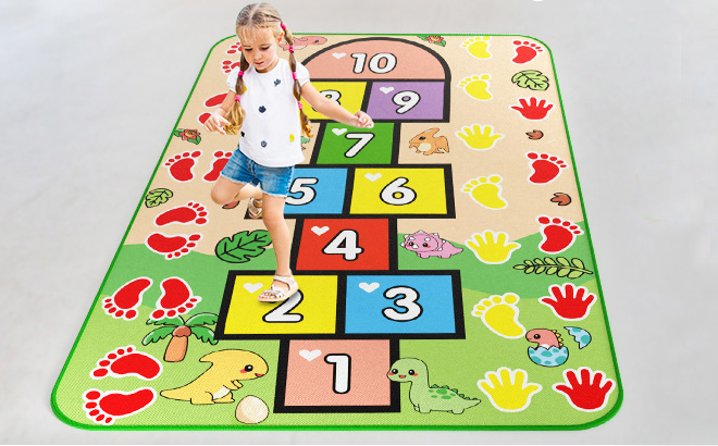 A Girl Playing Hopscotch on a Water Doodle Mat A Girl Playing Hopscotch on a Water Doodle Mat