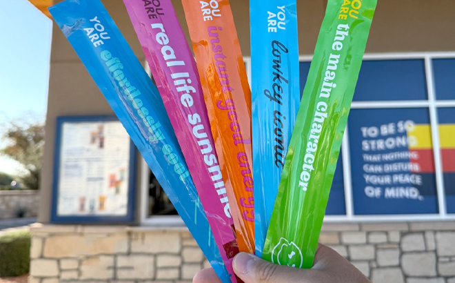 A Man Holding Color Changing Vibe Straws at Dutch Bros Coffee