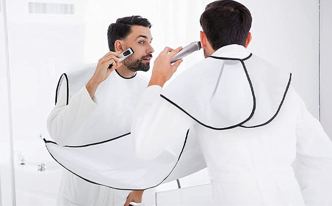 A Man Shaving His Beard While Using the Beard Bib Beard Apron
