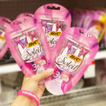 A Person Holding 3 Packs of BIC Soleil Twilight Disposable Razors