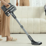 A Person Holding Cordless Vacuum Cleaner