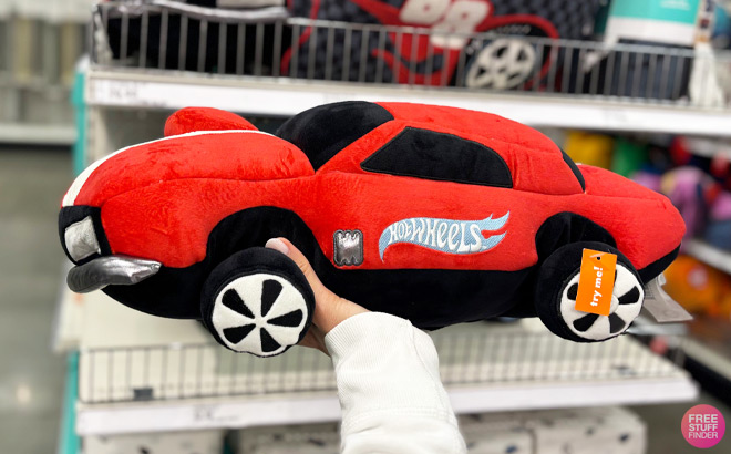 A Person Holding Pillowfort Hot Wheels Classic Light Up Car Plush Pillow