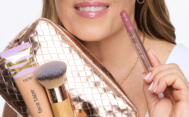 A Person Holding Tarte Super Size Face Tape Foundation 3 Piece Kit with Bag A Person Holding Tarte Super Size Face Tape Foundation 3 Piece Kit with Bag