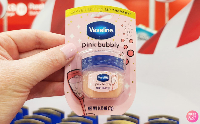 A Person Holding Vaseline Holiday Limited Edition Pink Bubbly Cutie Lip Balm