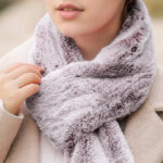 A Person Holding a Rechargeable Heated Scarf