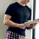 A Person Wearing Gildan Mens Crew T Shirt