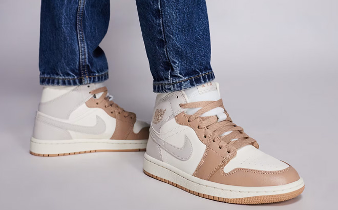 A Person Wearing Nike Air Jordan 1 Mid Shoes