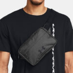 A Person Wearing Under Armour Essential Lite Waist Bag Crossbody