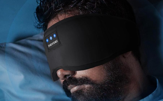 A Person Wearing the Deep Sleep Mask with Bluetooth Headphones