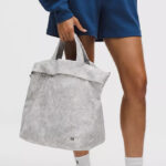 A Person holding a Lululemon Tote On My Level Tote Bag