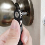 A Person using a Heleman Right Angle Screwdriver