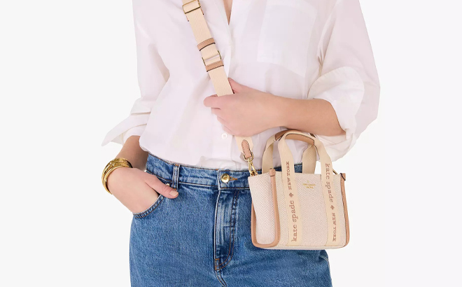 A Person wearing a Kate Spade Outlet Kip Canvas Mini Tote Bag A Person wearing a Kate Spade Outlet Kip Canvas Mini Tote Bag