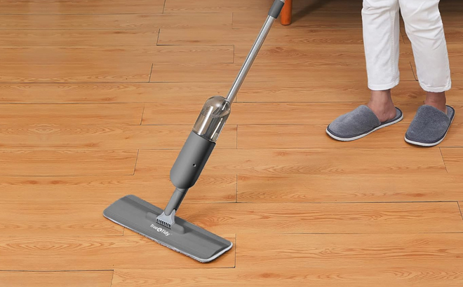 A Woman Cleaning Hardwood Floors with True Tidy Spray Mop A Woman Cleaning Hardwood Floors with True Tidy Spray Mop