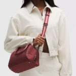 A Woman Wearing Lululemon Bowler Crossbody Bag 4 5L