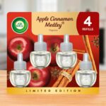 Air Wick Plug In Scented Oil Refill in Apple Cinnamon Medley Scent 4 Pack on the Table