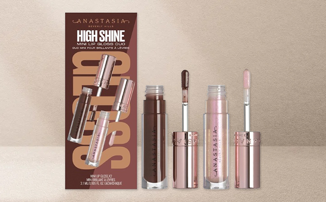 Anastasia Beverly Hills Mini High Shine Lip Gloss Duo on a Beige Background