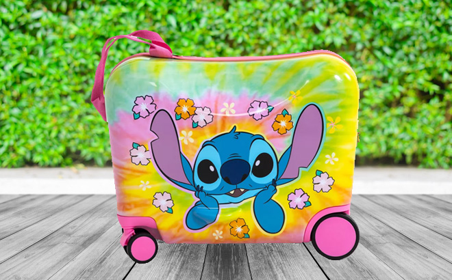 Disney Stitch Checked Hardside Ride on Luggage on the Table