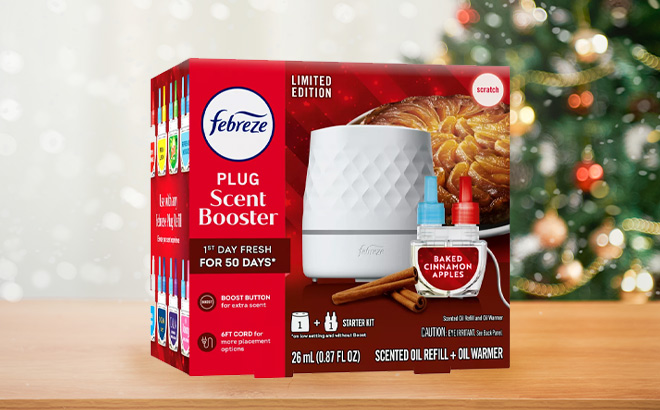 Febreze Plug Scent Booster with Baked Cinnamon Apple Air Fresheners on the Table