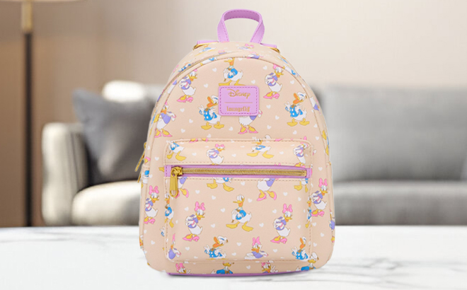 Loungefly Disney Donald Duck Daisy Duck Classic Mini Backpack on a Table