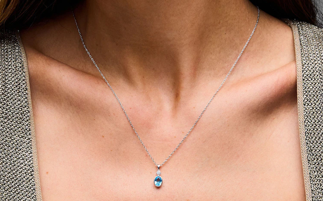 Zales Oval Swiss Blue Topaz and Lab Grown Diamond Accent Pendant in Sterling Silver Zales Oval Swiss Blue Topaz and Lab Grown Diamond Accent Pendant in Sterling Silver
