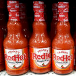 12 Ounce Bottles of Franks Hot Sauce on a Store Shelf