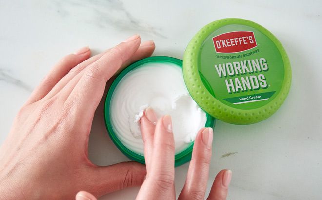 A Person Applying OKeeffes Working Hands Hand Cream on Their Hand A Person Applying OKeeffes Working Hands Hand Cream on Their Hand