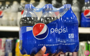 A Person Holding A Pepsi 6 Pack