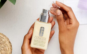 A Person Holding Clinique Dramatically Different Moisturizing Lotion with Pump