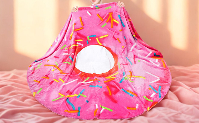 A Person Holding a Pink Donut Blanket