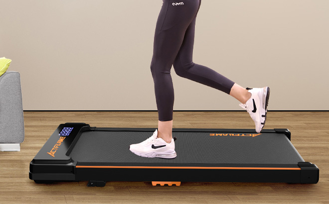 A Person Using ACTFLAME Walking Pad with Incline A Person Using ACTFLAME Walking Pad with Incline