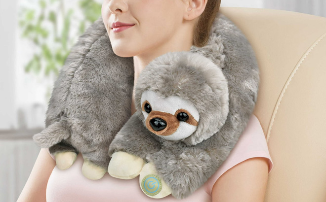 A Person Using a Sloth Neck Massager Plush