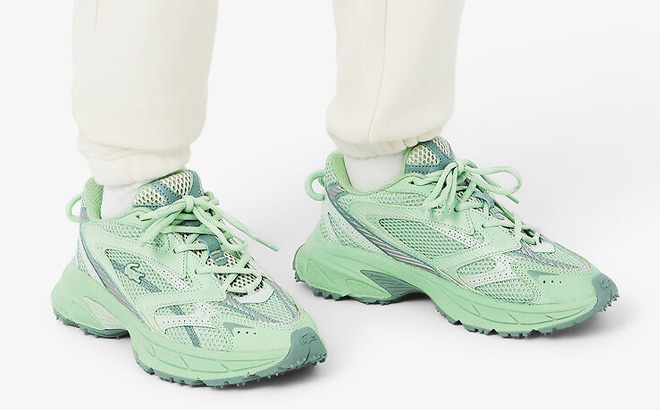 A Person Wearing Lacoste Womens L003 Neo Shot Sneakers