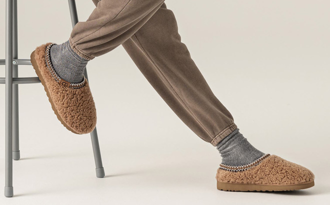 A Person Wearing UGG Womens Tasman Maxi Curly Slippers in Chestnut A Person Wearing UGG Womens Tasman Maxi Curly Slippers in Chestnut
