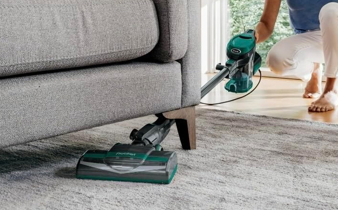 A Person is Using Shark Corded Stick Vacuum
