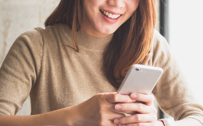 A Woman Using Origin Financial App A Woman Using Origin Financial App