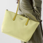 A Woman Wearing Kate Spade Kitt Nylon Medium Tote