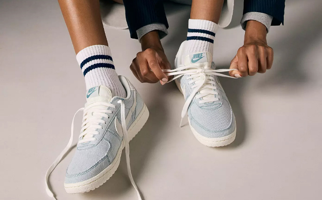 A Woman Wearing Nike Denim Field General Sneakers