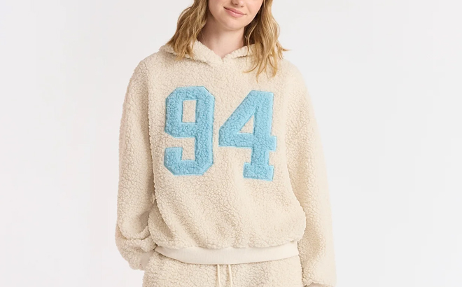 A Woman Wearing No Boundaries Embroidered Plush Pullover Hoodie