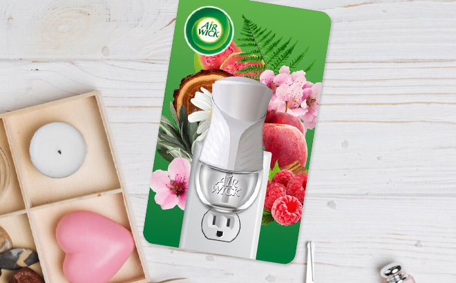 Air Wick Plug In Air Freshener Scented Oil Warmer Device on the Table