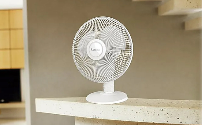 Lasko White 12 Inch Table Fan on a Counter