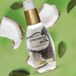 OGX Nourishing Coconut Milk Anti Breakage Serum on Green Background
