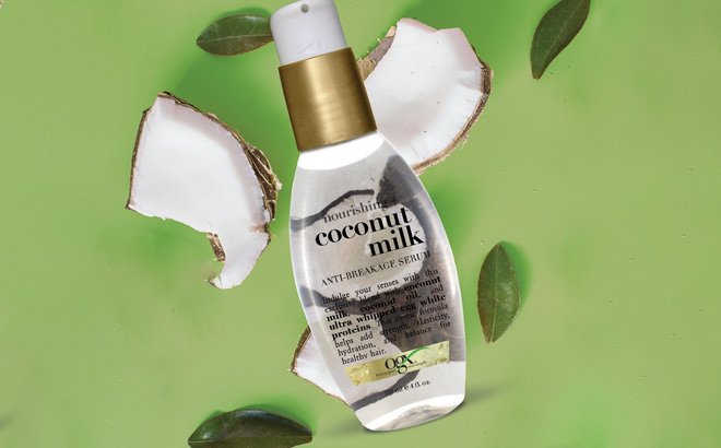 OGX Nourishing Coconut Milk Anti Breakage Serum on Green Background