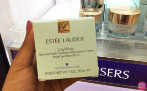 Person Holding Estee Lauder Moisturizier