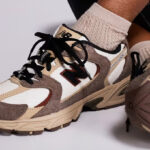 Person Wearing New Balance 530 Brown Shoes